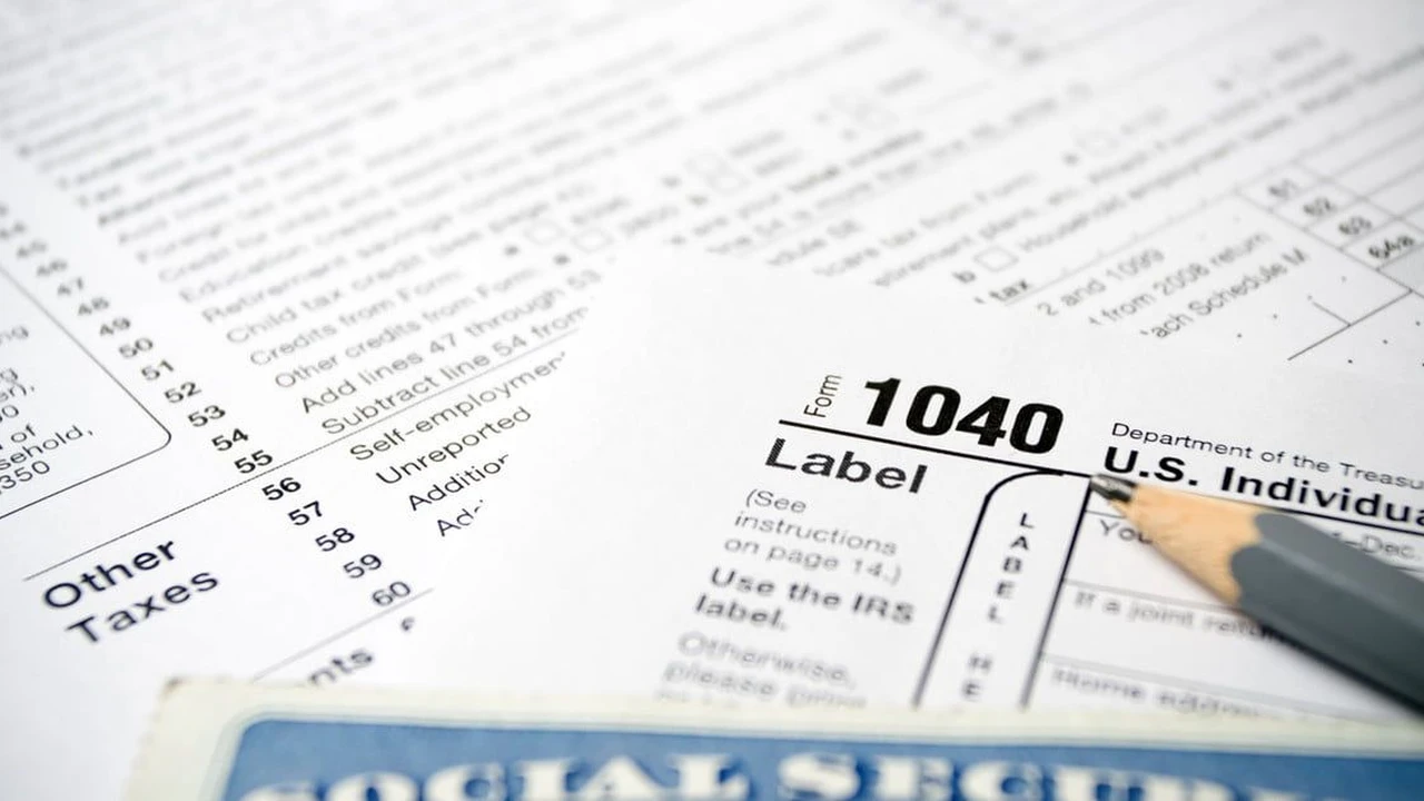 Close up on a plate of mashed potatoes, topped with baked pork chops with cream of mushroom soup, and a side of green beans.