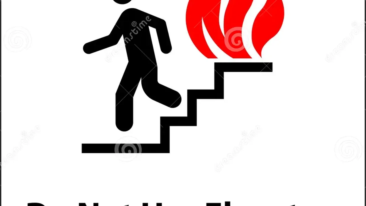 Close up on a plate of mashed potatoes, topped with baked pork chops with cream of mushroom soup, and a side of green beans.