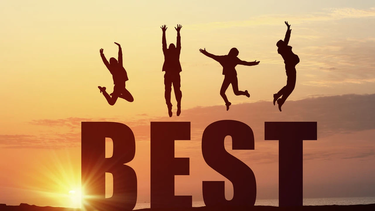 blue bowl of black bean beef tortilla soup on a board with cilantro and shredded cheese in background