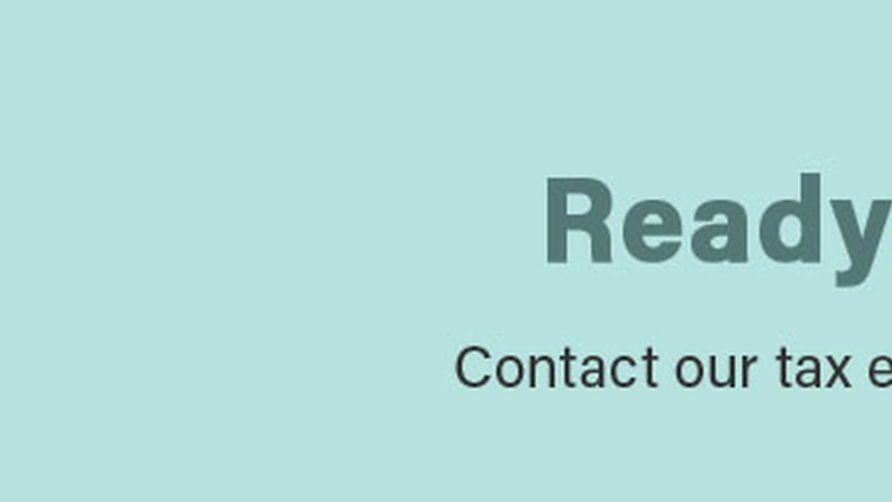 overhead view of corned beef sliced and on a platter with cabbage, potatoes, and carrots