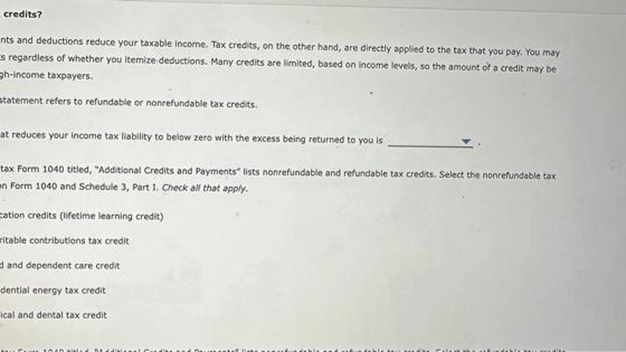 Close up on a plate of mashed potatoes, topped with baked pork chops with cream of mushroom soup, and a side of green beans.
