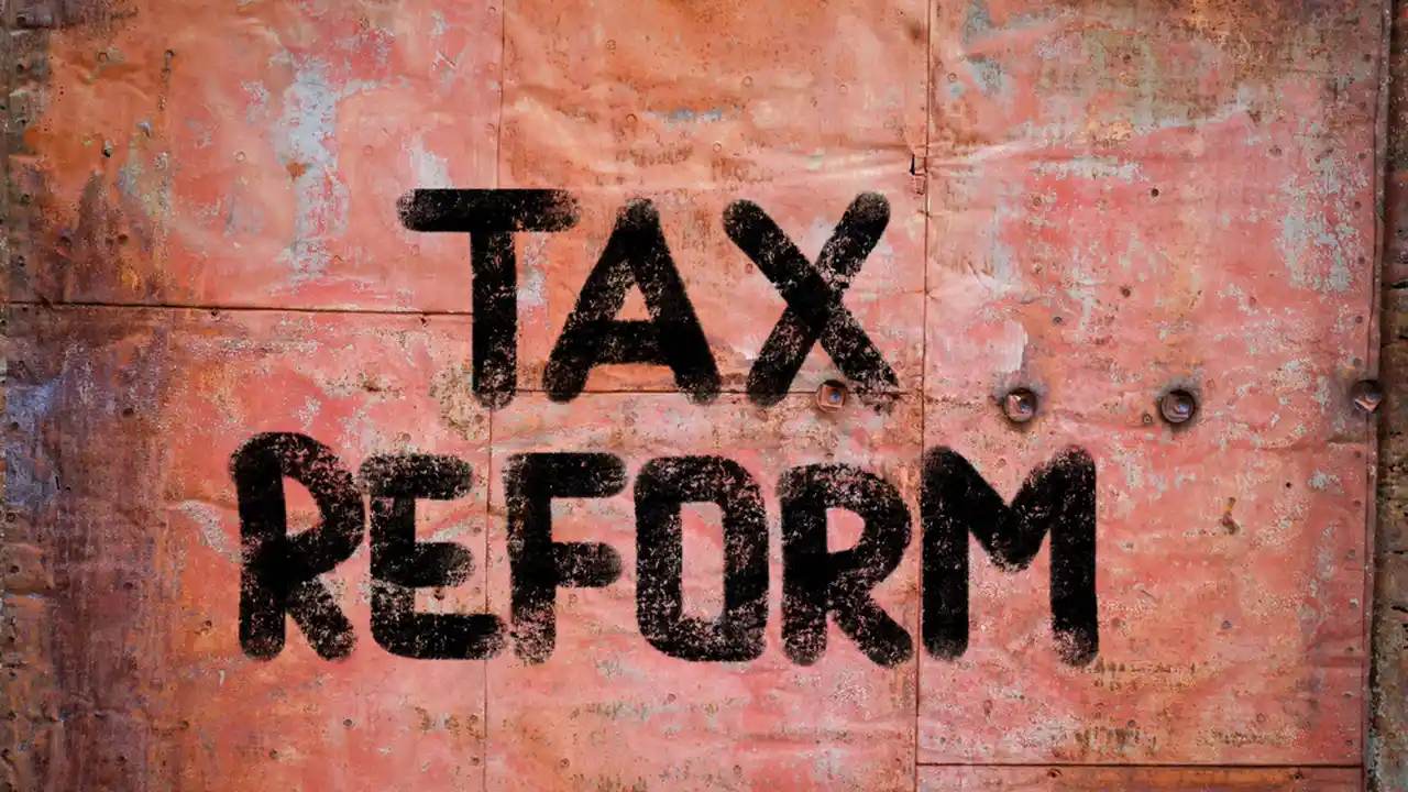 Close up on a plate of mashed potatoes, topped with baked pork chops with cream of mushroom soup, and a side of green beans.